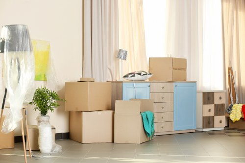 Same day removals team loading furniture in a Belgravia street