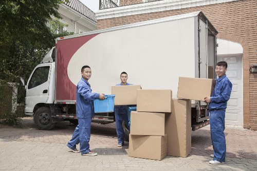 Worker assessing items before loading into a van