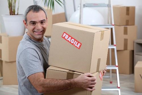 Office relocation planning in Belgravia with moving boxes and furniture