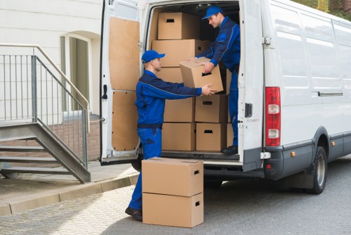 Student removals team planning a move in Belgravia with boxes and careful loading